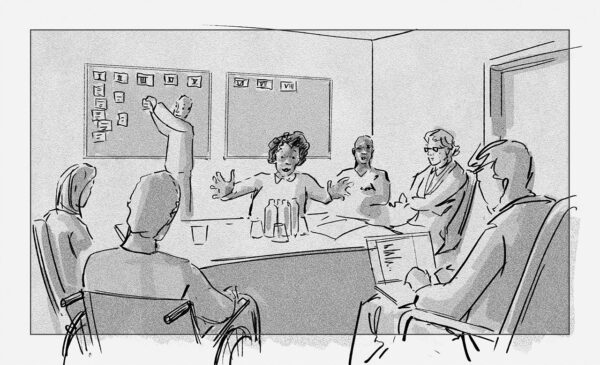Gruppe brainstormt im Writers Room mit Tafel und Kärtchen